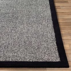 SURYA HAND TUFTED WOOL BORDER RUG: BLACK