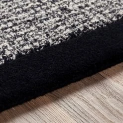SURYA HAND TUFTED WOOL BORDER RUG: BLACK