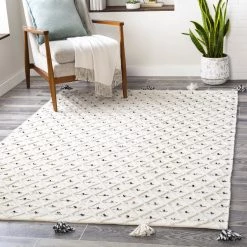 SURYA AZA POM INDOOR-OUTDOOR RUG: IVORY