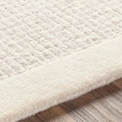 SURYA HAND TUFTED WOOL BORDER RUG: CREAM