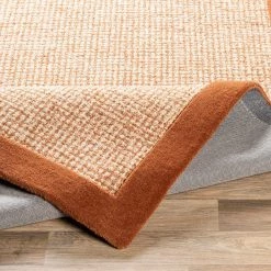 SURYA HAND TUFTED WOOL BORDER RUG: RUST