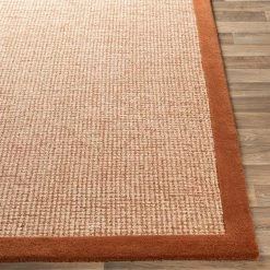 SURYA HAND TUFTED WOOL BORDER RUG: RUST