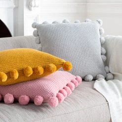 SURYA Pillows + Decor KNITTED COTTON POM PILLOW
