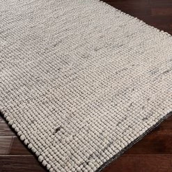 SURYA NUBBY WOVEN WOOL RUG: IVORY, BLACK