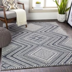 SURYA RADKA INDOOR-OUTDOOR RUG: CHARCOAL + WHITE