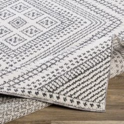 SURYA RADKA INDOOR-OUTDOOR RUG: CHARCOAL + WHITE