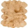 SURYA SHEEPSKIN HIDE RUG: CAMEL